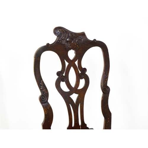 1581 - A pair of 18thC Anglo-Portuguese dining chairs with unusual shaped and carved cresting rails above p... 