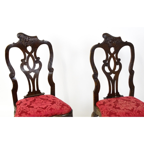 1581 - A pair of 18thC Anglo-Portuguese dining chairs with unusual shaped and carved cresting rails above p... 