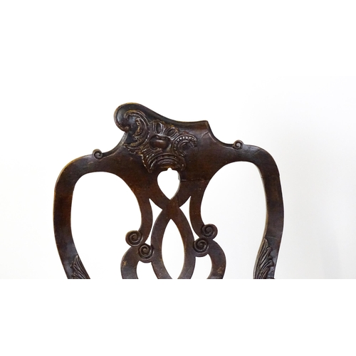 1581 - A pair of 18thC Anglo-Portuguese dining chairs with unusual shaped and carved cresting rails above p... 