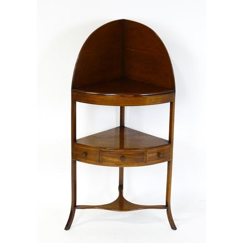 1604 - A late Georgian mahogany washstand with a removeable top. The stand having a large upstand above two... 