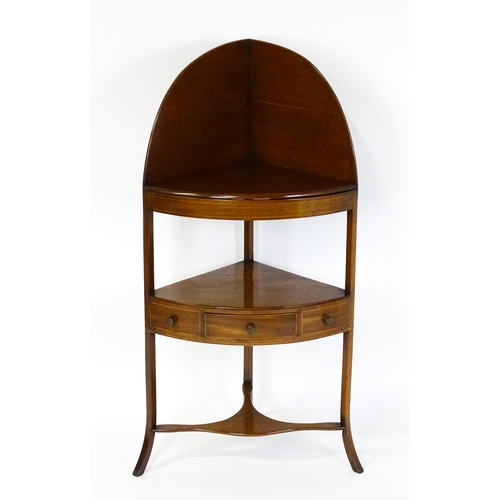 1604 - A late Georgian mahogany washstand with a removeable top. The stand having a large upstand above two... 