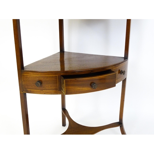 1604 - A late Georgian mahogany washstand with a removeable top. The stand having a large upstand above two... 