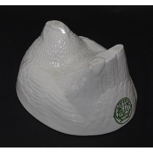 1106 - An early 20thC Green's Newstyle Jellies jelly / blancmange mould modelled as a nesting chicken. Appr... 