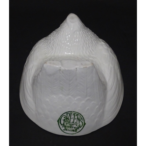 1106 - An early 20thC Green's Newstyle Jellies jelly / blancmange mould modelled as a nesting chicken. Appr... 