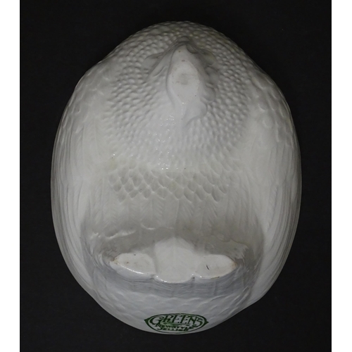 1106 - An early 20thC Green's Newstyle Jellies jelly / blancmange mould modelled as a nesting chicken. Appr... 