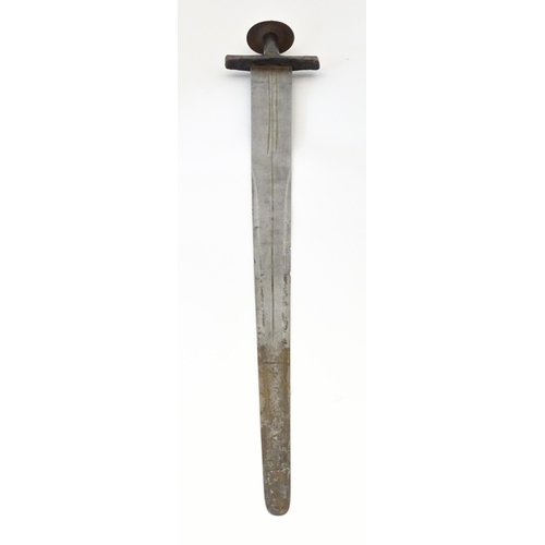 835 - Militaria : an early 20thC North African Tuareg takoba sword and scabbard , the leather covered hilt... 