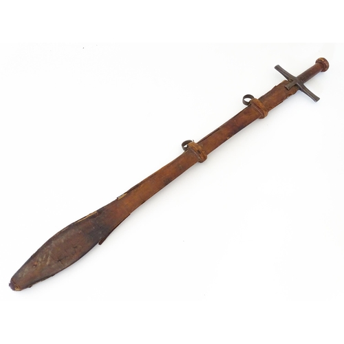 839 - Militaria : an early 20thC Sudanese Kaskara sword and scabbard, the leather covered handle with disc... 