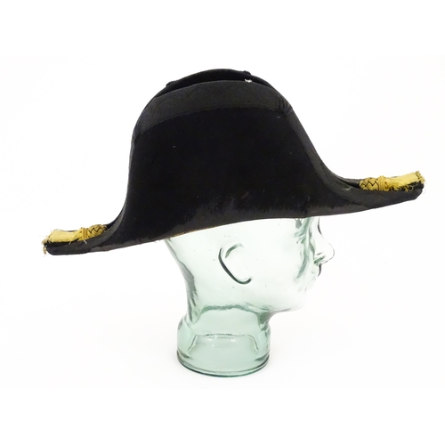 841 - Militaria : a 19thC Royal Navy Officer's bicorn hat by J Baker & Co of Portsmouth , the interior wit... 