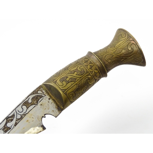 846 - An early to mid 20thC Kukri / Khukuri knife and leather sheath , the brass sectional hilt and steel ... 