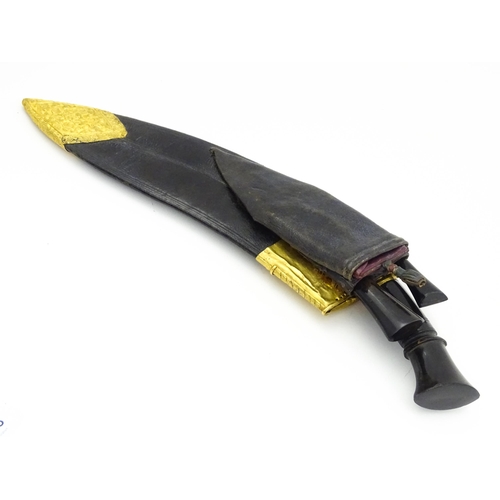 848 - An early 20thC Nepalese Royal Kothimora Kukri / Khukuri knife and sheath, the steel bhojpure blade w... 