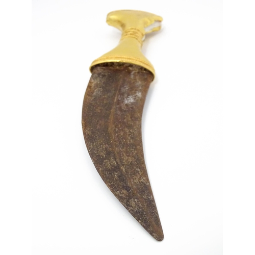 849 - An early 20thC Yemeni Jambiya dagger and sheath, the steel blade with yellow metal hilt decorated wi... 