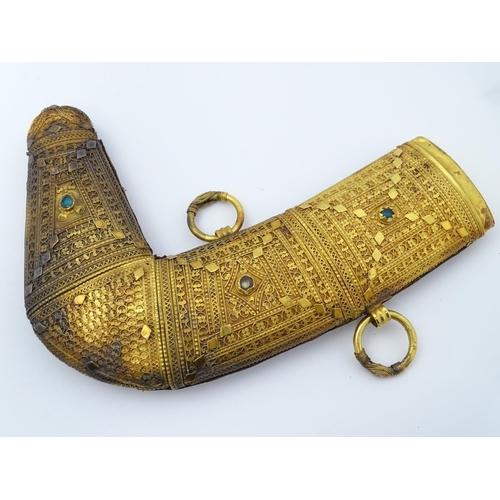 849 - An early 20thC Yemeni Jambiya dagger and sheath, the steel blade with yellow metal hilt decorated wi... 