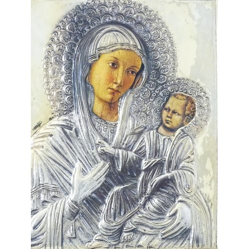 1056 - A 19thC Italian icon depicting Madonna and Child with an embossed silver surround. Marked lower left... 