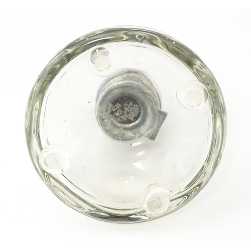 489A - A glass  dressing table scent / perfume bottle raised on four glass bun feet, the silver top hallmar... 