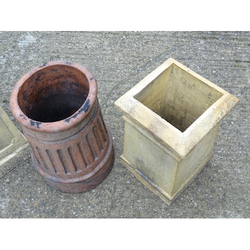 1334 - Four chimney pots, to include two terracotta and two stoneware examples, the largest approx 31