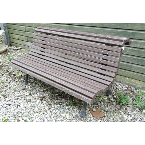 1335 - An early 20thC tennis bench , with Coalbrookdale style cast iron frame and hardwood slats , approx 6... 