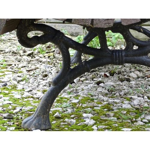 1335 - An early 20thC tennis bench , with Coalbrookdale style cast iron frame and hardwood slats , approx 6... 