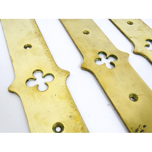 1347 - A quantity of cast brass Gothic revival door fingerplates, with pierced quatrefoil decoration to the... 