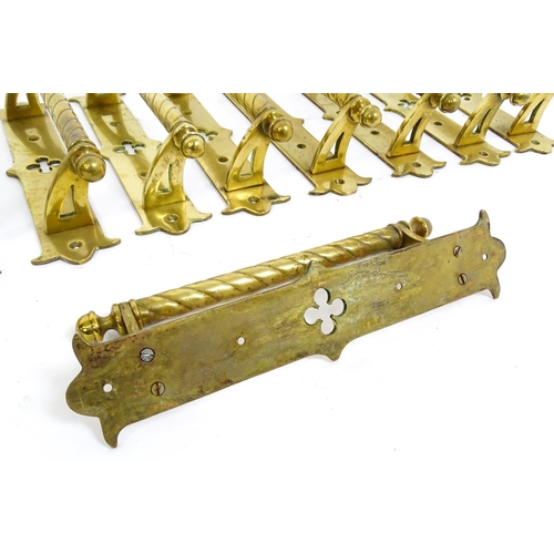 1348 - A quantity of cast brass Gothic revival door handles, the mounts with pierced quatrefoil decoration ... 