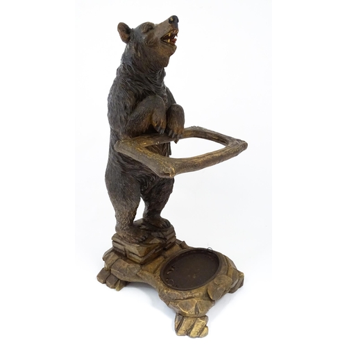 1272 - A late 19thC German carved Black Forest stick stand / umbrella stand of stand bear form. Approx. 34 ... 