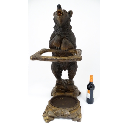 1272 - A late 19thC German carved Black Forest stick stand / umbrella stand of stand bear form. Approx. 34 ... 