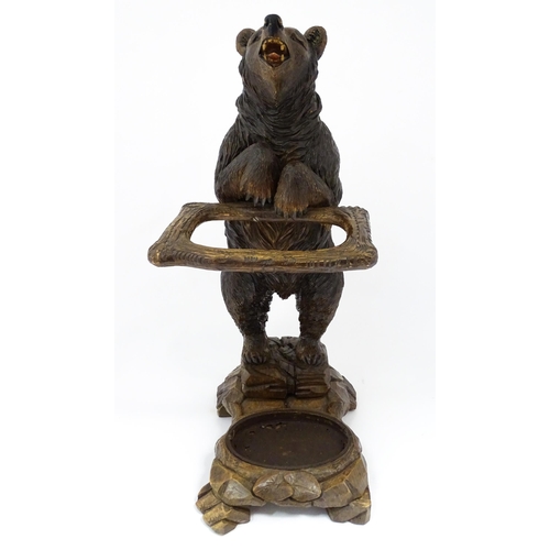 1272 - A late 19thC German carved Black Forest stick stand / umbrella stand of stand bear form. Approx. 34 ... 