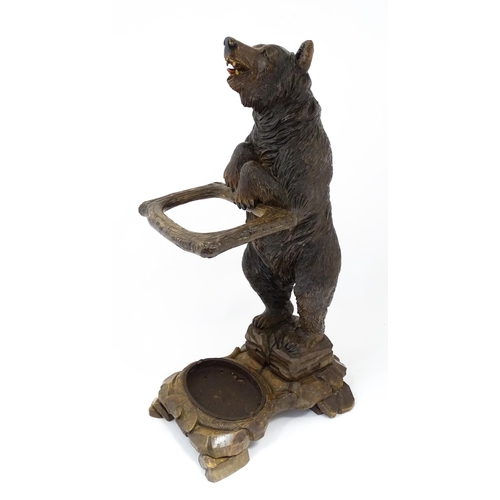 1272 - A late 19thC German carved Black Forest stick stand / umbrella stand of stand bear form. Approx. 34 ... 