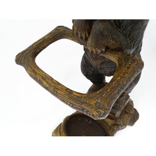 1272 - A late 19thC German carved Black Forest stick stand / umbrella stand of stand bear form. Approx. 34 ... 