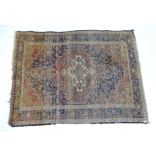 1363 - Carpet / Rug : A blue and red ground rug with floral and geometric motifs, with banded borders. Appr... 