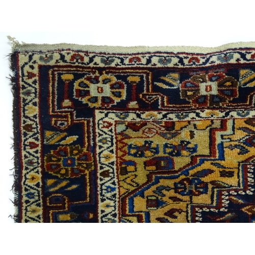 1363 - Carpet / Rug : A blue and red ground rug with floral and geometric motifs, with banded borders. Appr... 