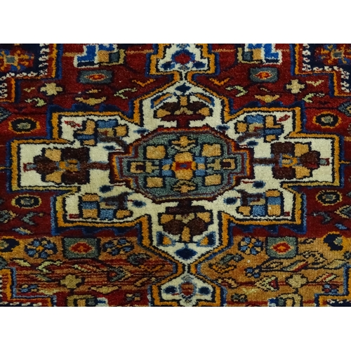 1363 - Carpet / Rug : A blue and red ground rug with floral and geometric motifs, with banded borders. Appr... 