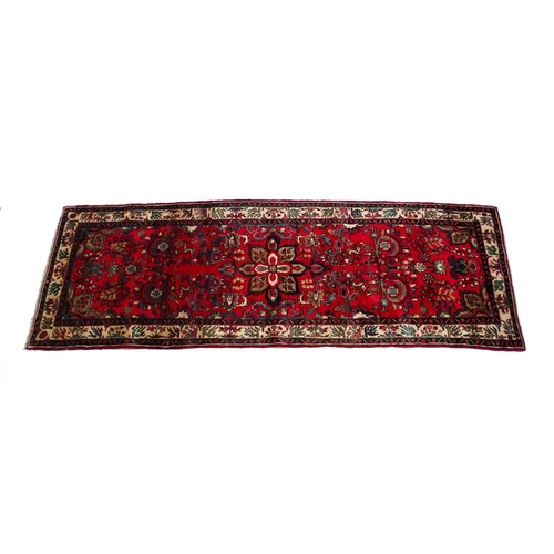 1378 - Carpet / Rug : A North West Persian Mahal runner the red ground with scrolling floral motifs and ban... 