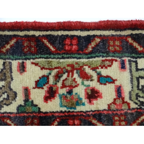 1378 - Carpet / Rug : A North West Persian Mahal runner the red ground with scrolling floral motifs and ban... 