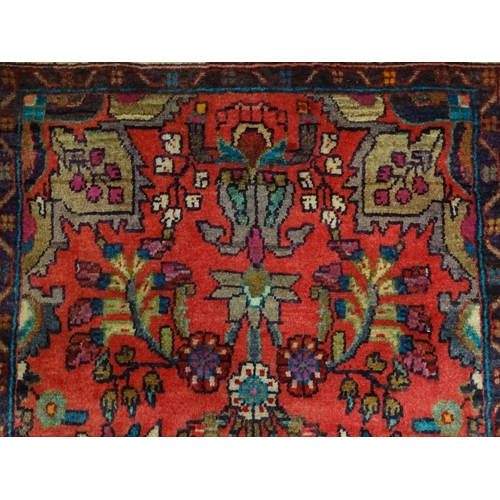 1378 - Carpet / Rug : A North West Persian Mahal runner the red ground with scrolling floral motifs and ban... 