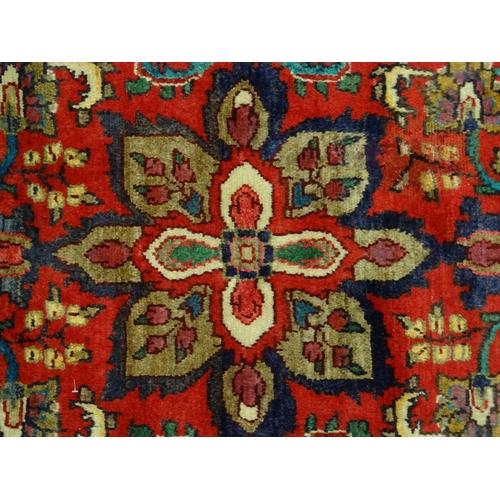 1378 - Carpet / Rug : A North West Persian Mahal runner the red ground with scrolling floral motifs and ban... 