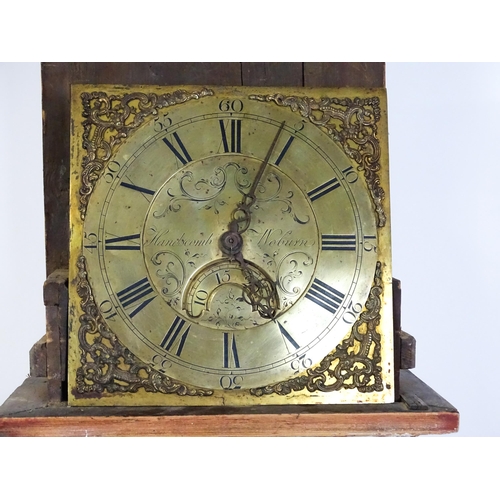 1389 - Local interest : A brass faced 30 hour long case clock the dial with Roman Chapter ring and Arabic s... 