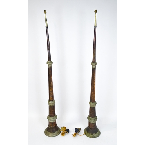 1431 - A pair of 20thC standard lamps formed from copper and brass Tibetan ceremonial trumpets. Approx. 64