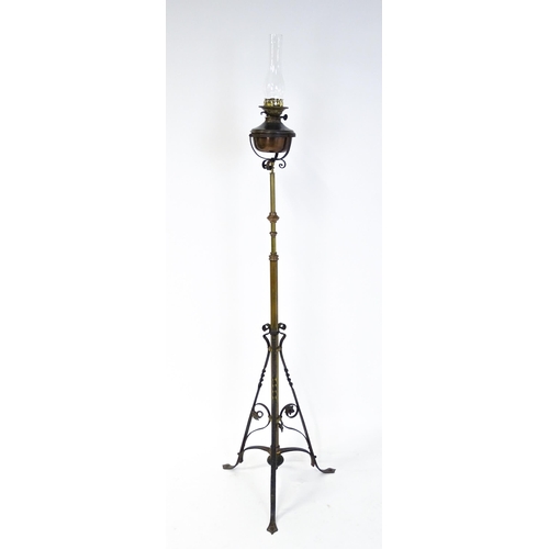 1432 - An Arts & Crafts telescopic standard lamp with oil lamp to top and cast iron base. Approx. 71