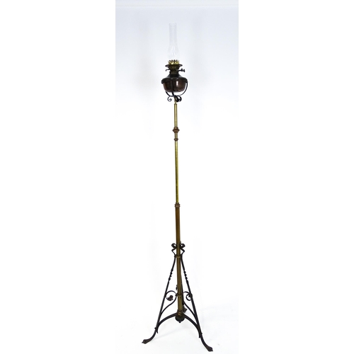 1432 - An Arts & Crafts telescopic standard lamp with oil lamp to top and cast iron base. Approx. 71