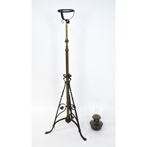 1432 - An Arts & Crafts telescopic standard lamp with oil lamp to top and cast iron base. Approx. 71