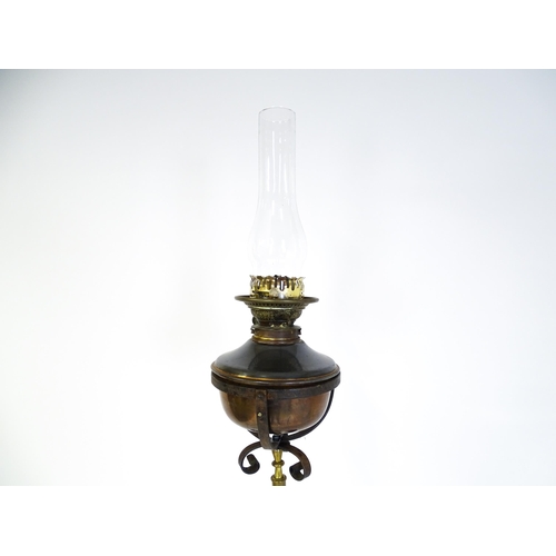 1432 - An Arts & Crafts telescopic standard lamp with oil lamp to top and cast iron base. Approx. 71