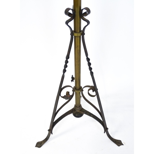 1432 - An Arts & Crafts telescopic standard lamp with oil lamp to top and cast iron base. Approx. 71