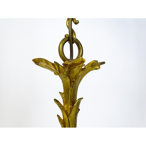 1435 - A gilt metal pendant chandelier / electrolier with acanthus scroll and cherub detail, having three c... 