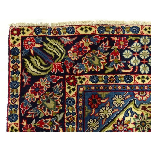 1376 - Carpet / Rug : A Central Persian Isafhan rug the red ground with central blue floral motif, further ... 