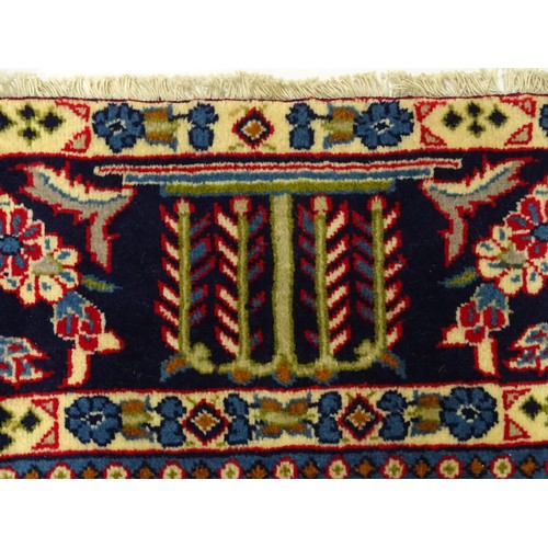 1376 - Carpet / Rug : A Central Persian Isafhan rug the red ground with central blue floral motif, further ... 