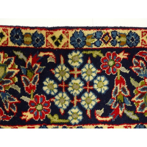 1376 - Carpet / Rug : A Central Persian Isafhan rug the red ground with central blue floral motif, further ... 