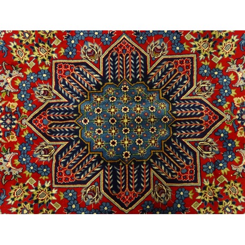 1376 - Carpet / Rug : A Central Persian Isafhan rug the red ground with central blue floral motif, further ... 