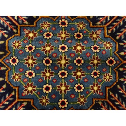 1376 - Carpet / Rug : A Central Persian Isafhan rug the red ground with central blue floral motif, further ... 