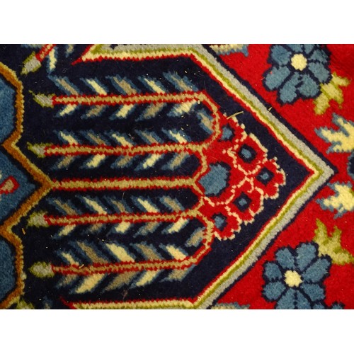 1376 - Carpet / Rug : A Central Persian Isafhan rug the red ground with central blue floral motif, further ... 