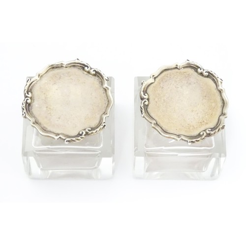 484A - A pair of glass inkwells with silver tops hallmarked London 1928, maker Mappin & Webb Ltd. Approx. 2... 